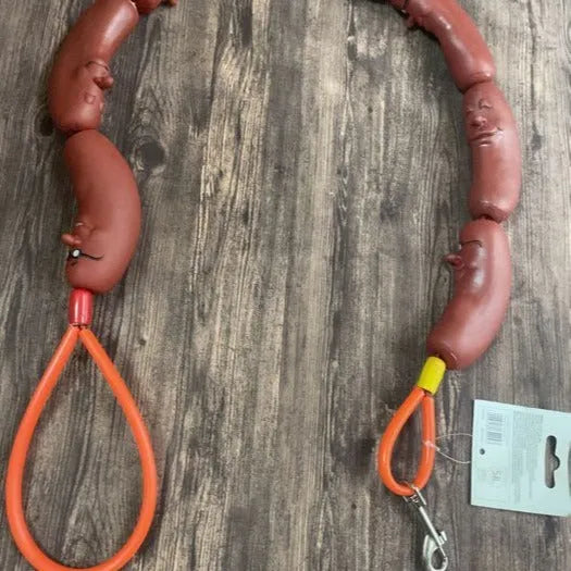 Brown cotton rope dog chew toy with sausage segments and hand grip, total length 108cm