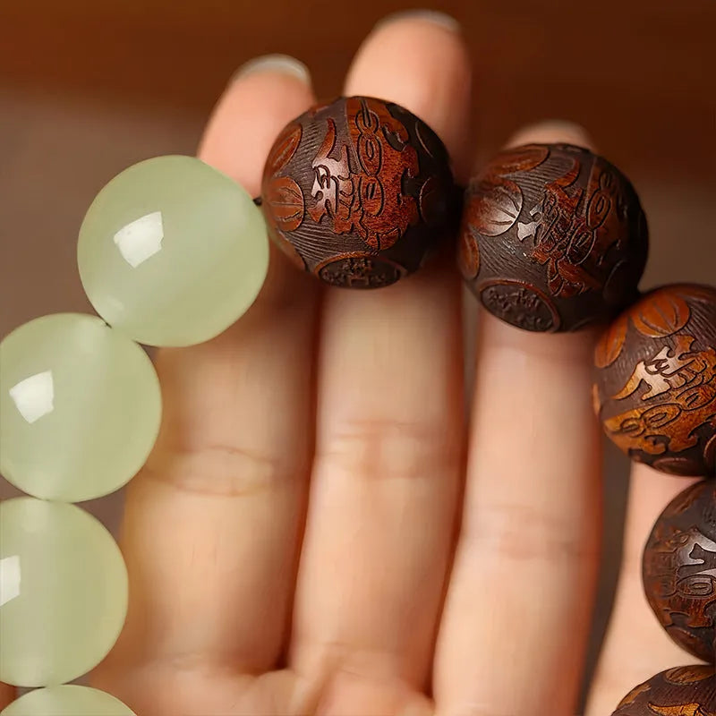 Wooden amass fortunes bracelet with carved Fu character design on rosewood