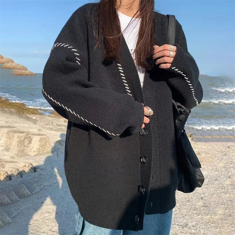 Women's loose-fit knitted cardigan coat in black or white, long sleeve