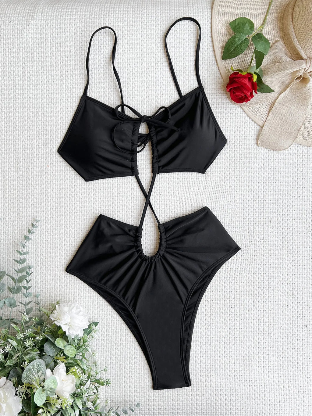 Women's sleeveless one-piece swimsuit with a hollow back, shown in green, red, and black colour options.