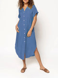 Loose fit solid colour midi dress with decorative buttons on a hanger