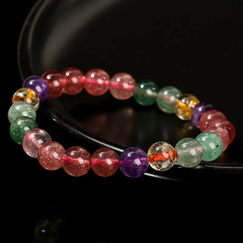 Natural strawberry quartz gemstone bracelet with round geometric beads.