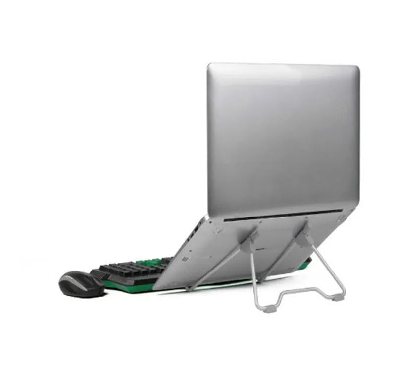Grey aluminium alloy and plastic stand holding a mobile phone and a laptop on a desk.