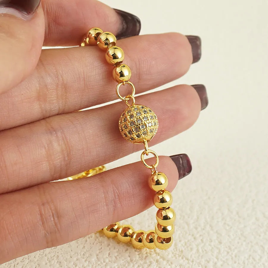 Copper heart-shaped bracelet with a single zircon stone in an Arabic style.