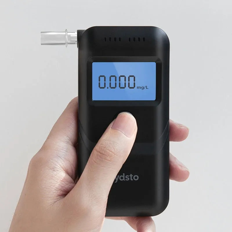 Black household alcohol breathalyser tester for personal drinking level monitoring