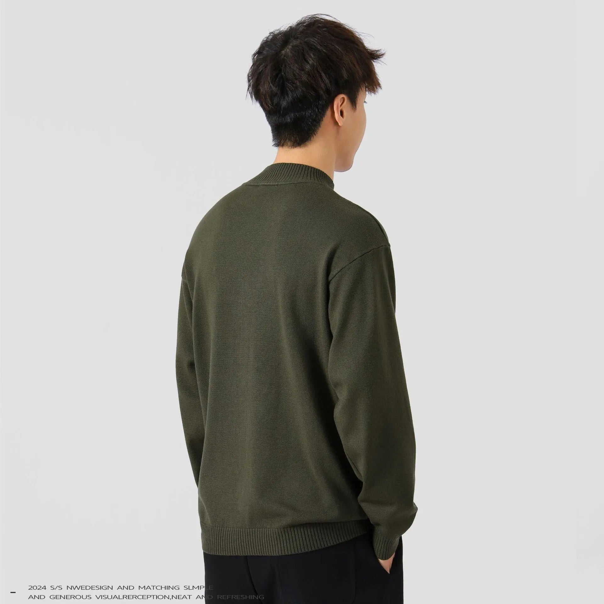 Men's loose fit long sleeve pullover sweater in a neutral colour on a hanger