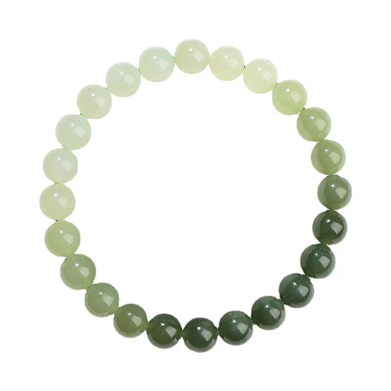 Natural clear water Hetian jade ball bracelet with gradient beads in round or barrel style.