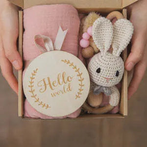 Baby teething gift set with wooden toys and large bamboo-cotton gauze blanket in assorted colours