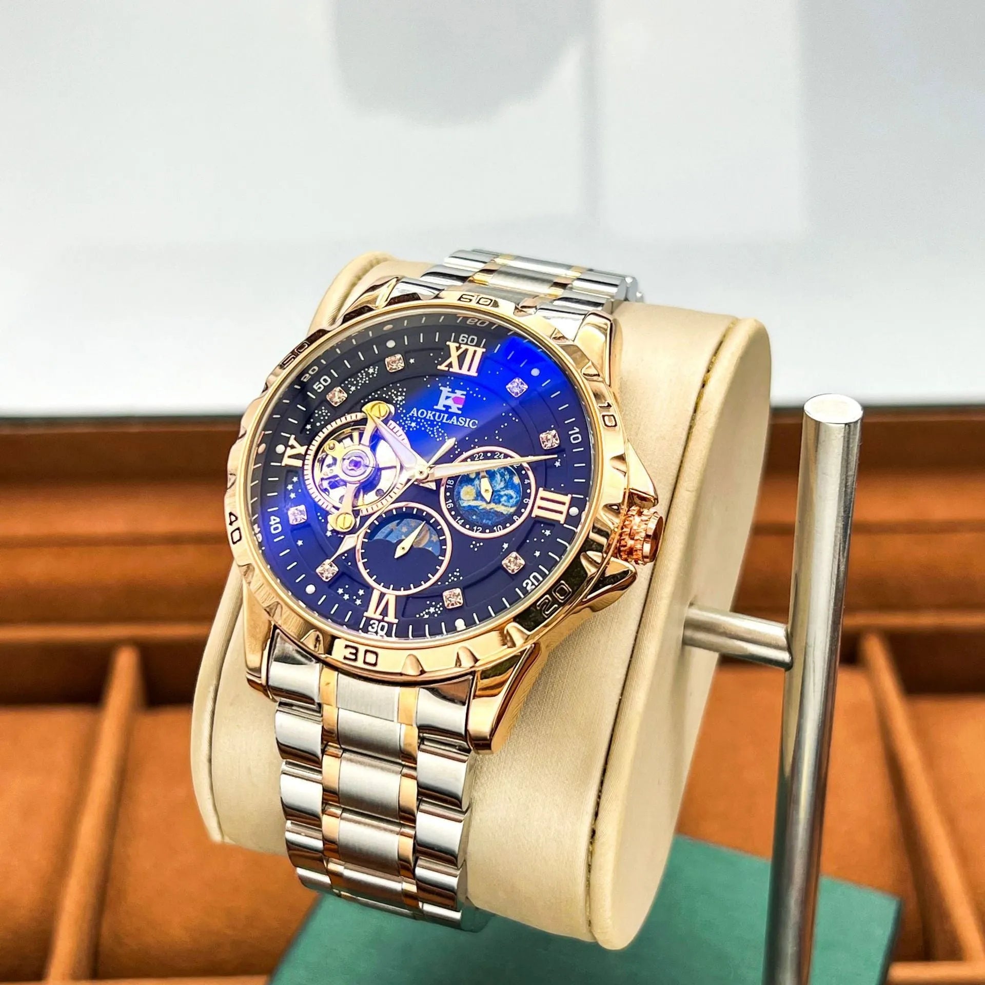 Men's automatic mechanical watch with rose gold case, black dial, and large display.