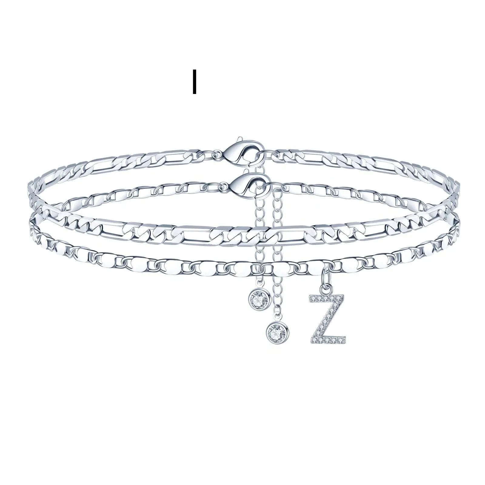 Silver-coloured copper anklet with a double-circle bead engraved with a letter.