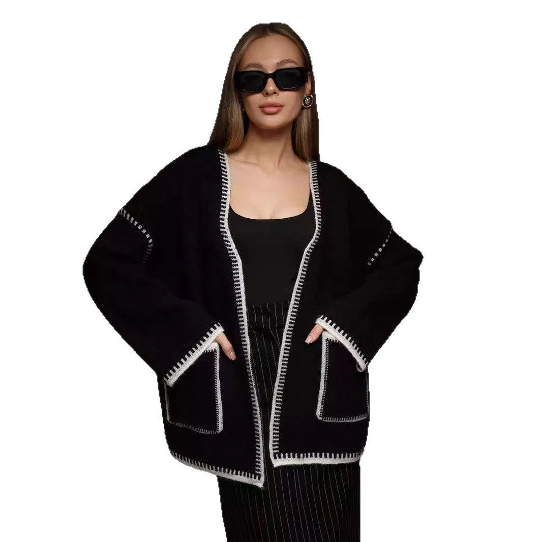 Loose mid-length knitted cardigan with lace-up front, in white, black, or camel.