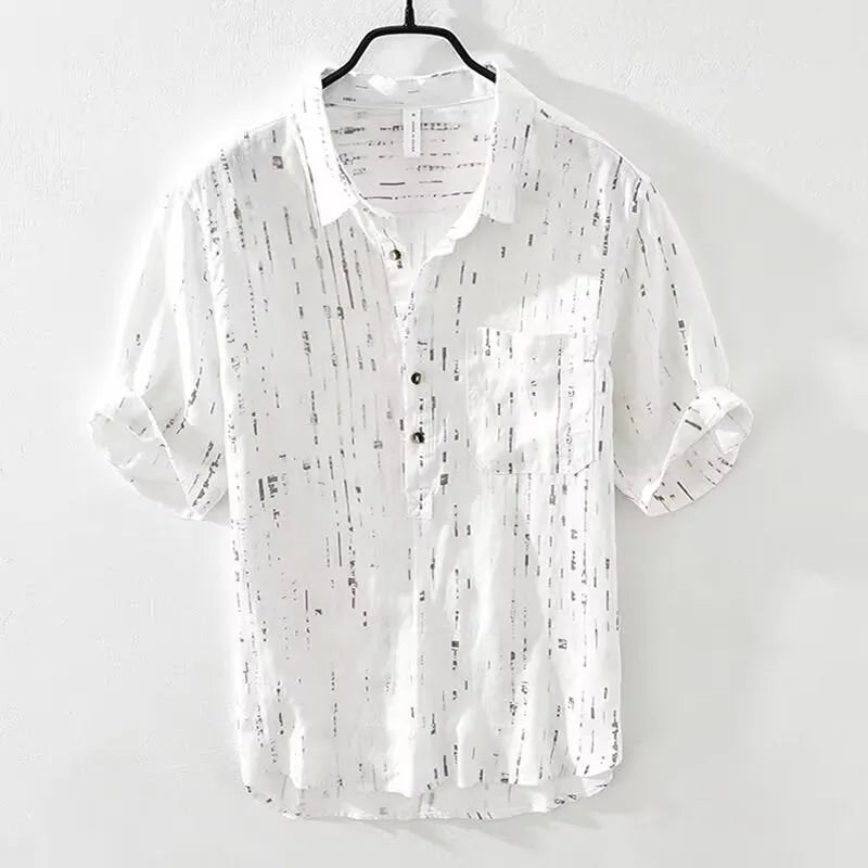 Man wearing a black loose-fit lapel polo shirt, short sleeves, casual summer style.
