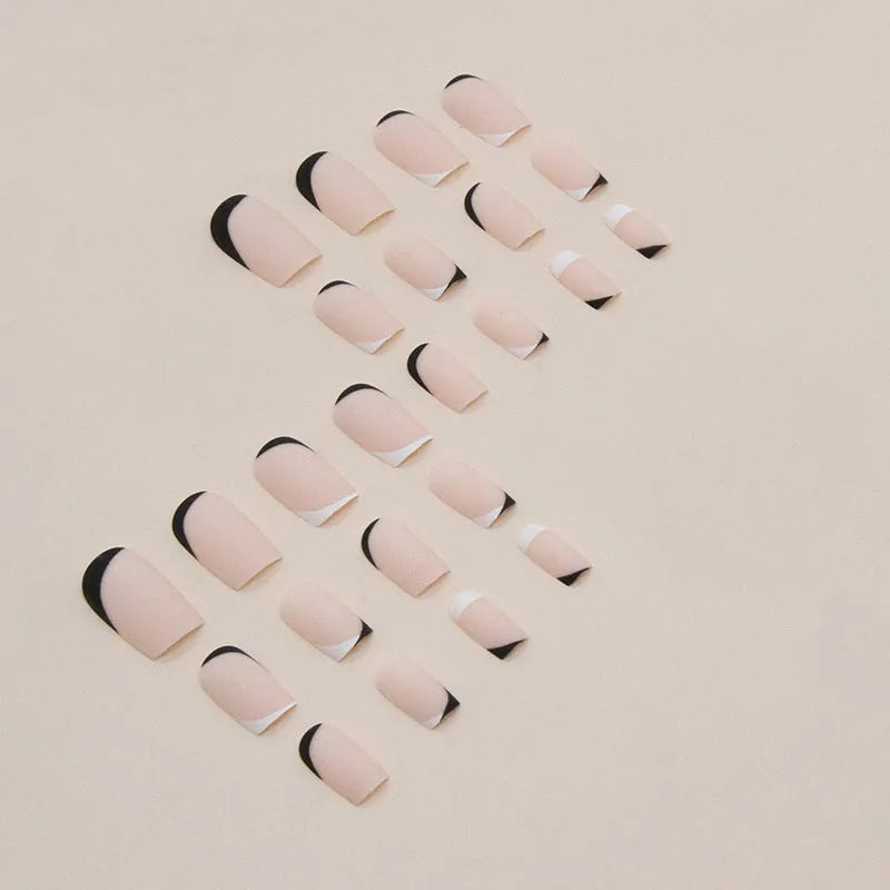 Black and white frosted matte artificial nails in a double-piece mandarin duck colour split design.