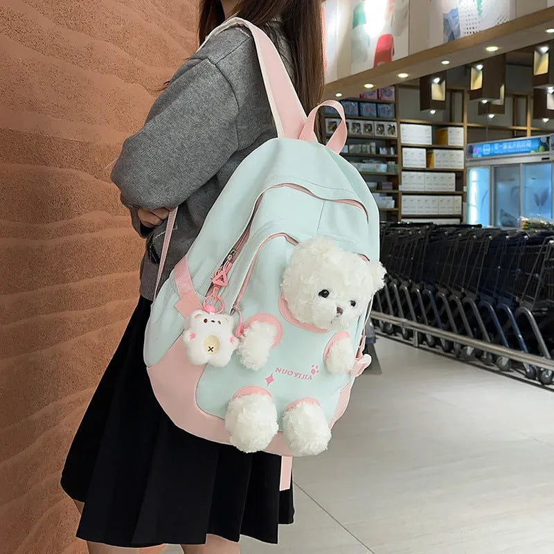 Literary style school backpack in macaron colours with curved shoulder straps and 20-35L capacity