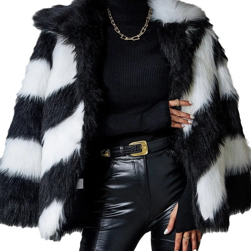 A minimalist faux fur coat with contrast lapels and a detachable fur collar, shown in picture colour.