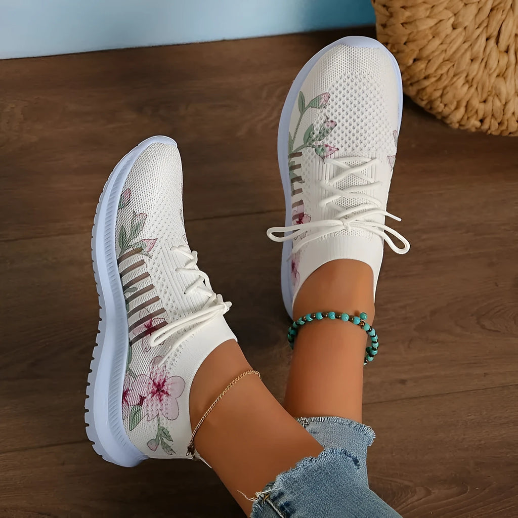 Milky white women's casual running shoes with mesh flyknit upper and rubber sole.