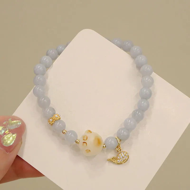 Aquamarine crystal bracelet with gold-plated climbing cat charm for women