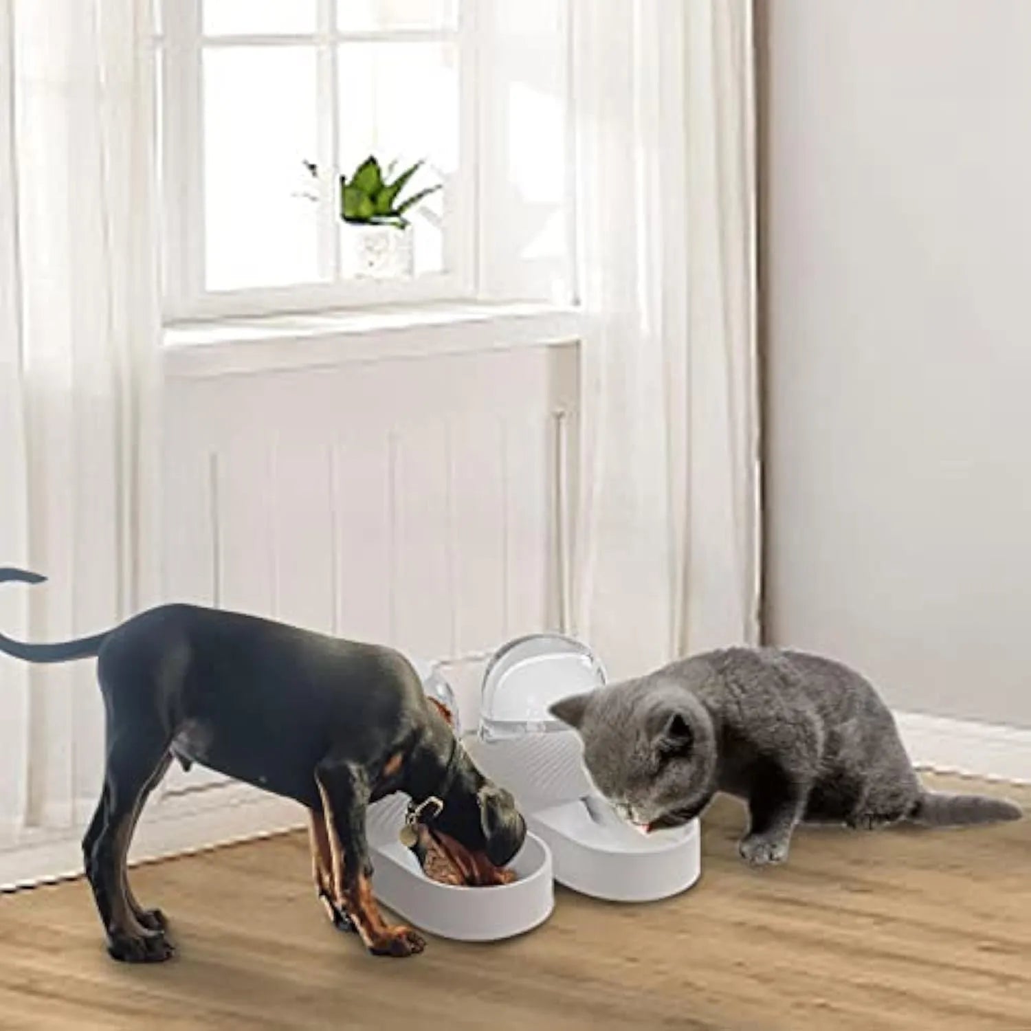 White wave-shaped automatic cat feeder and water dispenser set with 2-litre capacity.