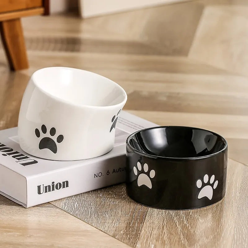 Ceramic cat bowl with high foot design and oblique mouth in cat's paw pattern