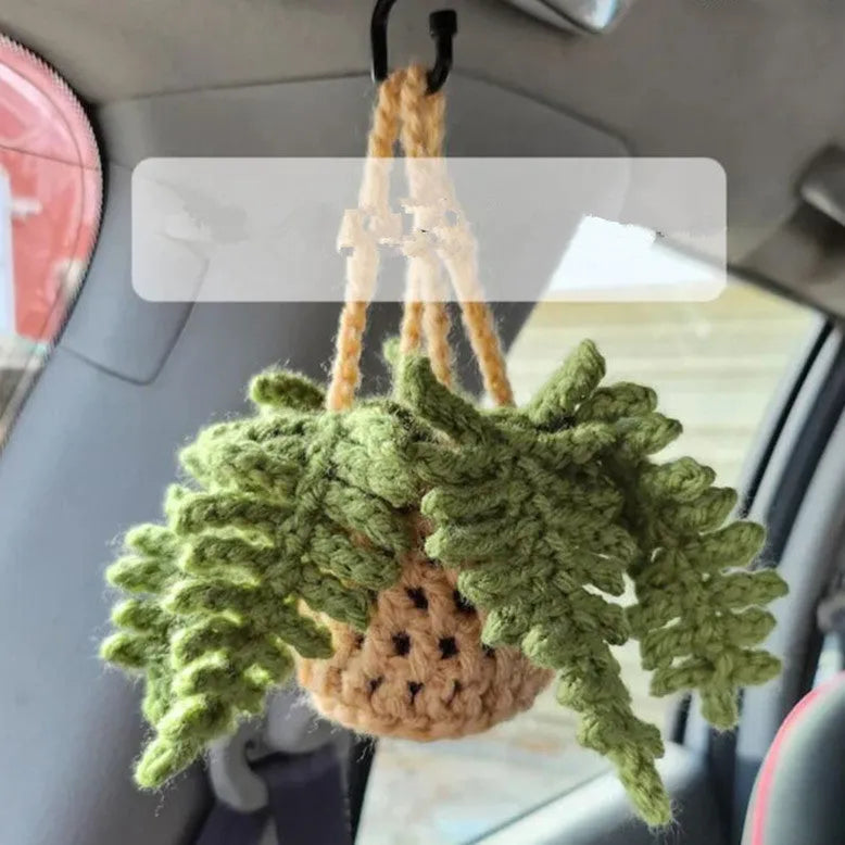 Green and white knitted wool car plant decoration with 8cm base and hanging rope.