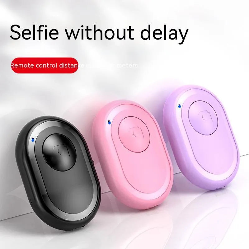 Compact black wireless Bluetooth remote control for smartphone camera photography