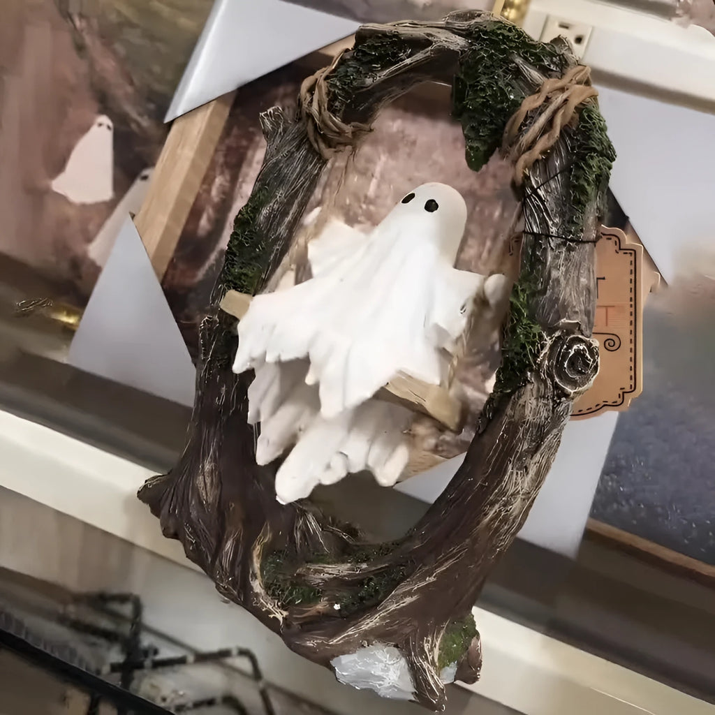 Grey resin Halloween ghost swing ornament with modern art design on display