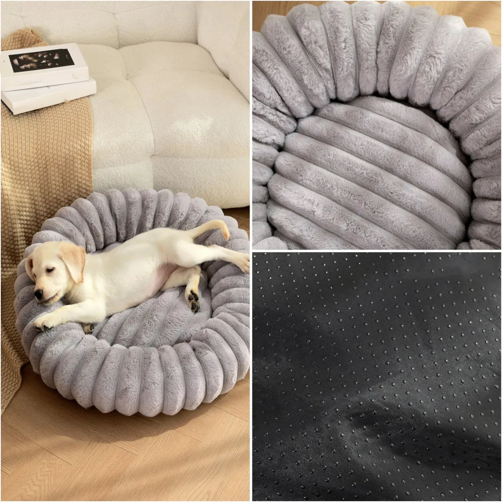 Round beige plush pet bed for a dog, shown in a medium size on a wooden floor.