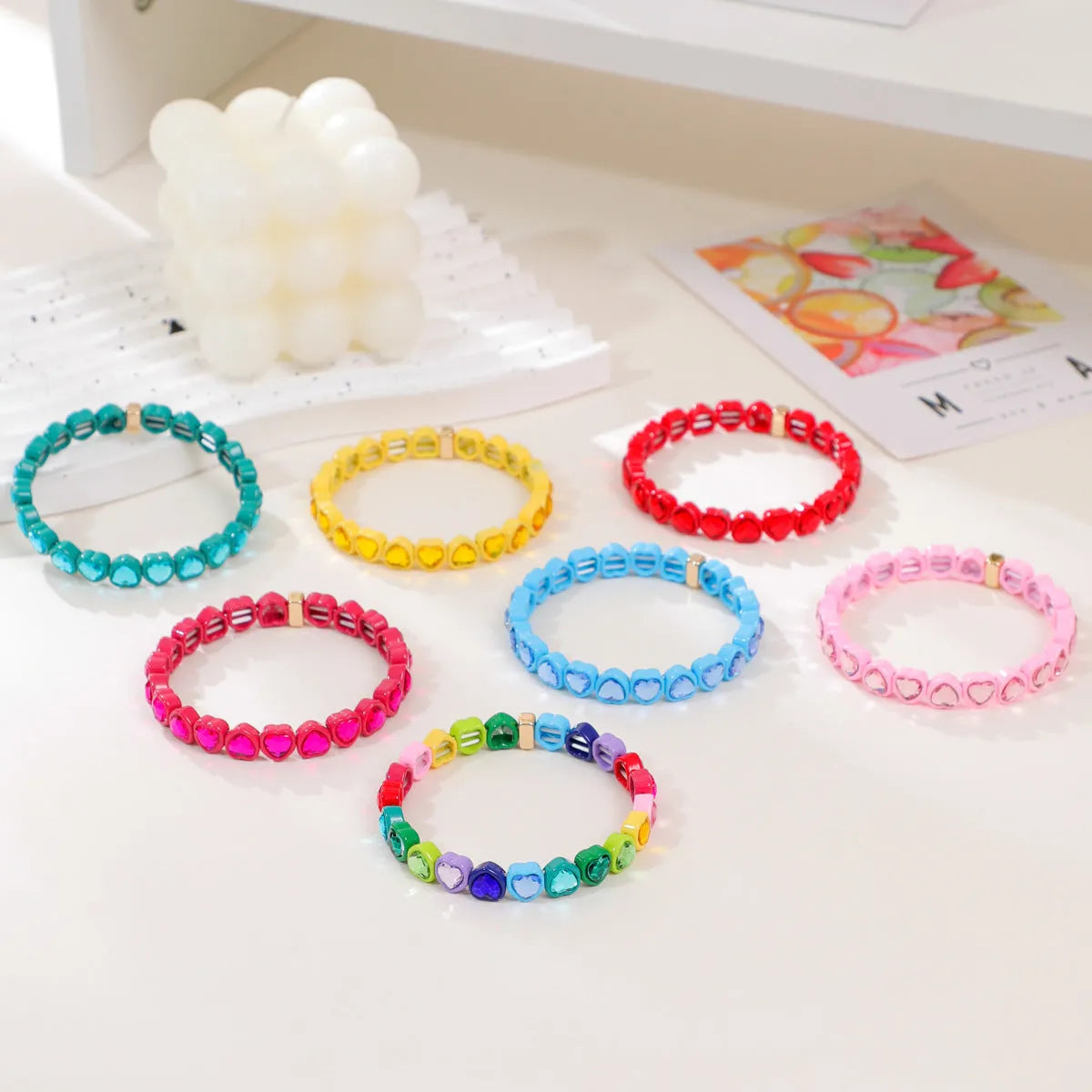 Rainbow coloured enamel heart pendant on stretch bracelet band