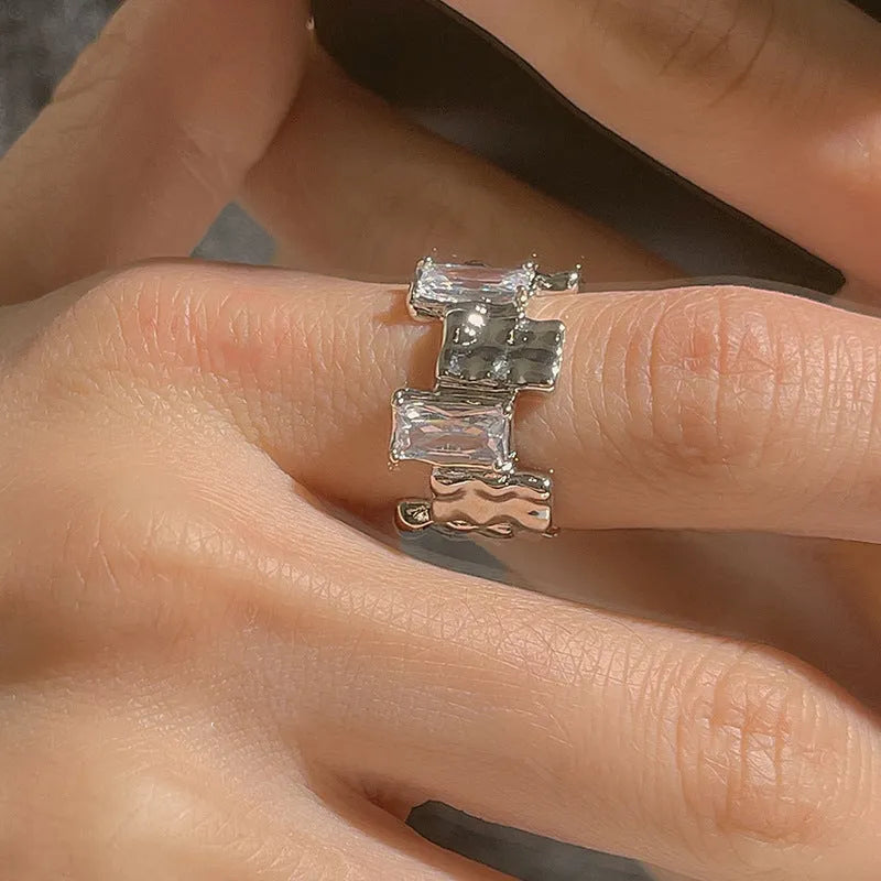 Geometric open design zircon ring in silver-plated metal with retro styling