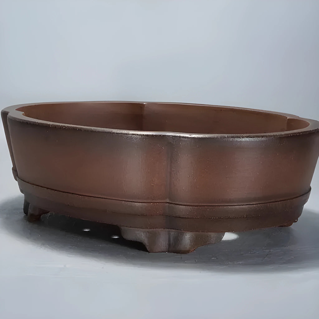 Classical purple clay bonsai pot with simple design, shown empty.