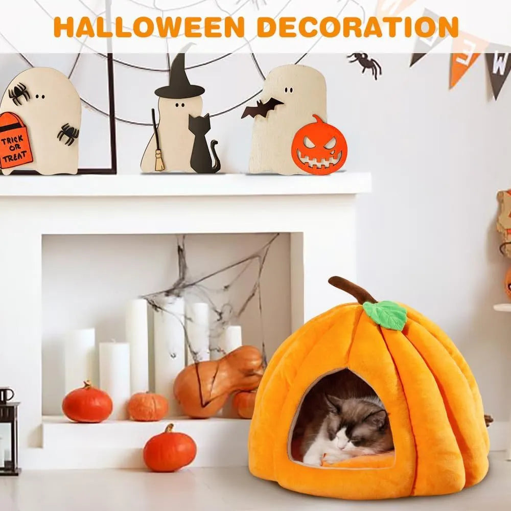 Grey pumpkin-shaped cat cave bed with plush fabric, shown with a small cat inside.