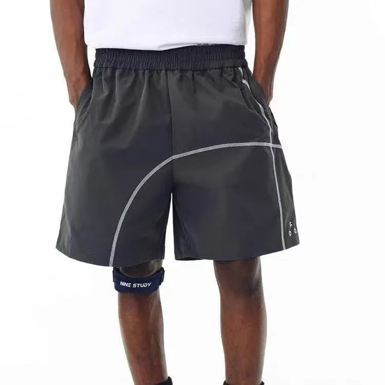 Retro style drawstring shorts in polyester fabric available in dark grey, white and apricot colours