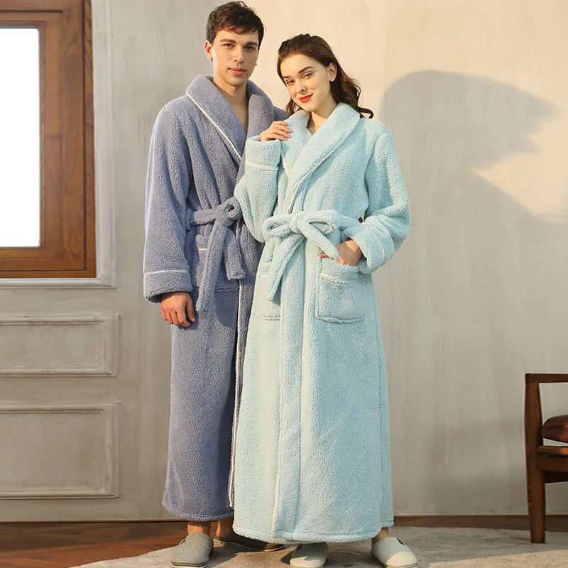 Man and woman wearing matching thick flannel bathrobes in winter colours like navy blue and cherry yellow.