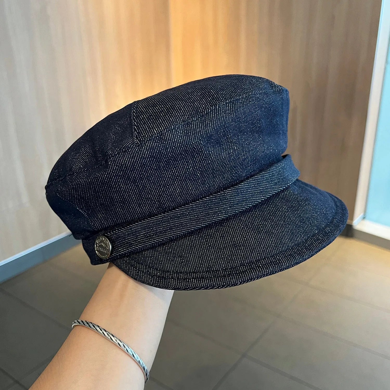 Dark blue denim octagonal newsboy hat with an adjustable fit for 54-58cm head sizes.