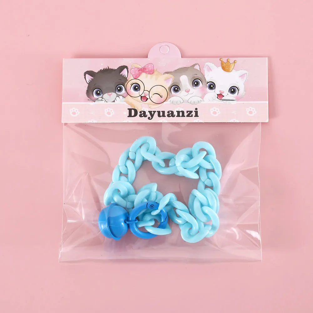 A plastic pet collar in macaron candy colours shown in blue, pink, and mixed variants, with a chain design and S/M size tags.