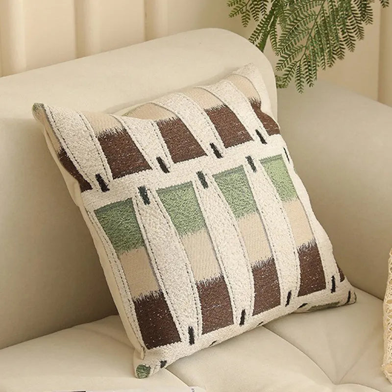 Close-up of a 45cm square jacquard cushion cover with a woven floral pattern in retro Nordic style.