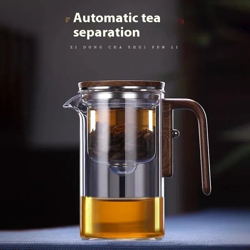 Glass teapot with magnetic tea leaf separator and wooden handle shown in new Chinese style.