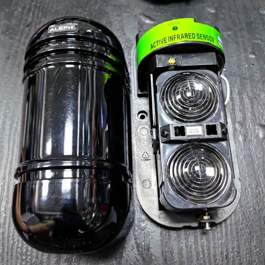 Black infrared anti-theft alarm detector pair for warehouse and commercial security