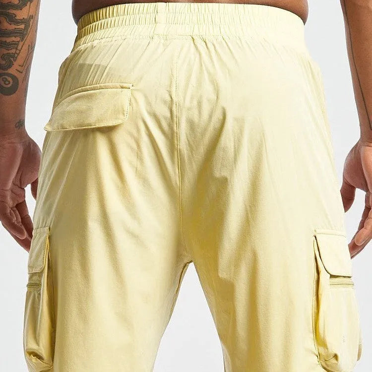 Man's black quick-drying sports shorts with elastic waistband for fitness and running activities.