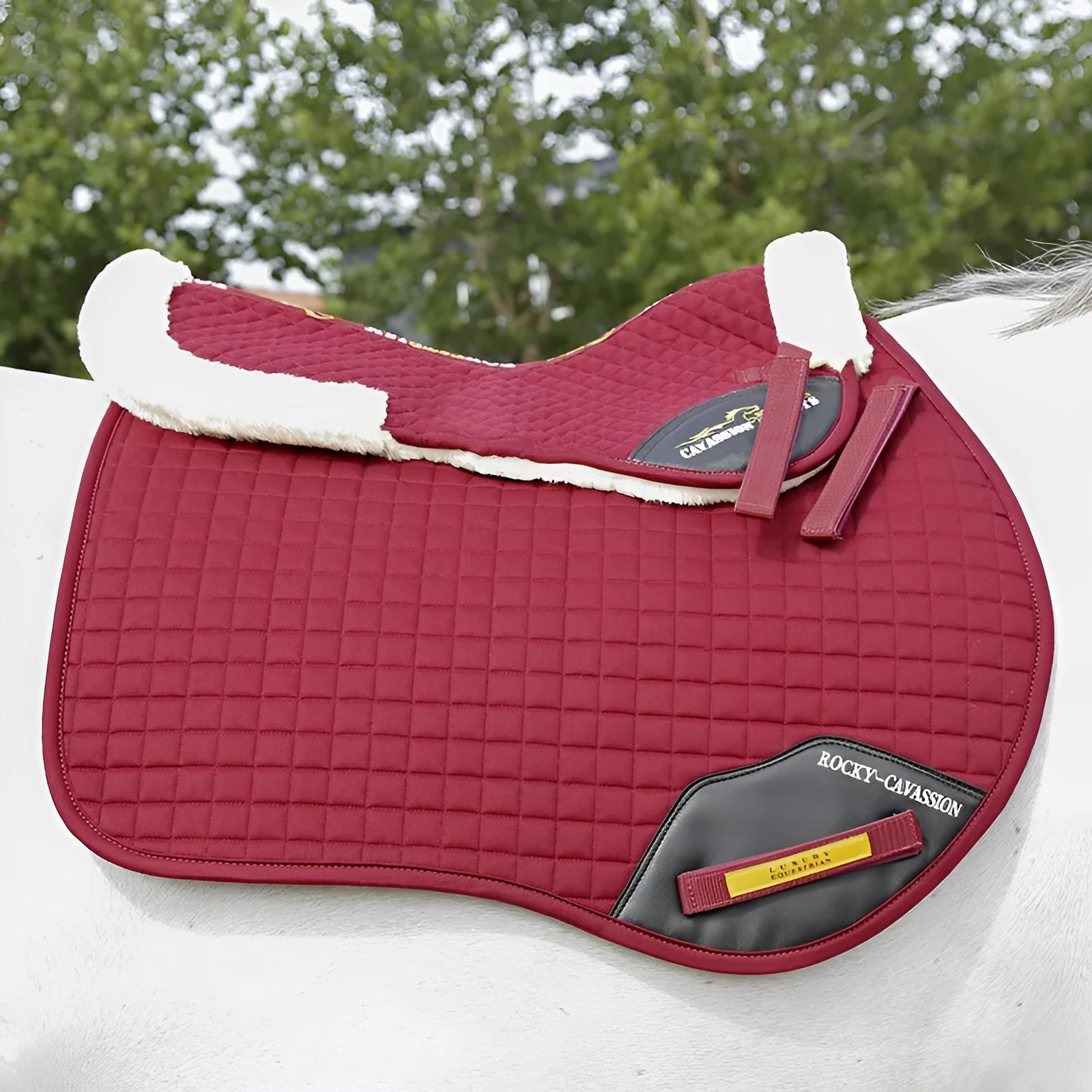 Riding saddle pad for shock absorption and waist protection in equestrian and cycling sports.