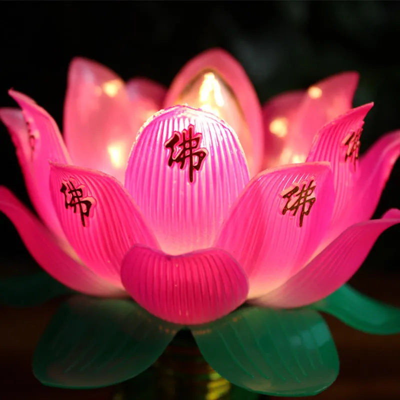 Plug-in Buddha worship lamp with colourful LED lotus flower design on a home altar.