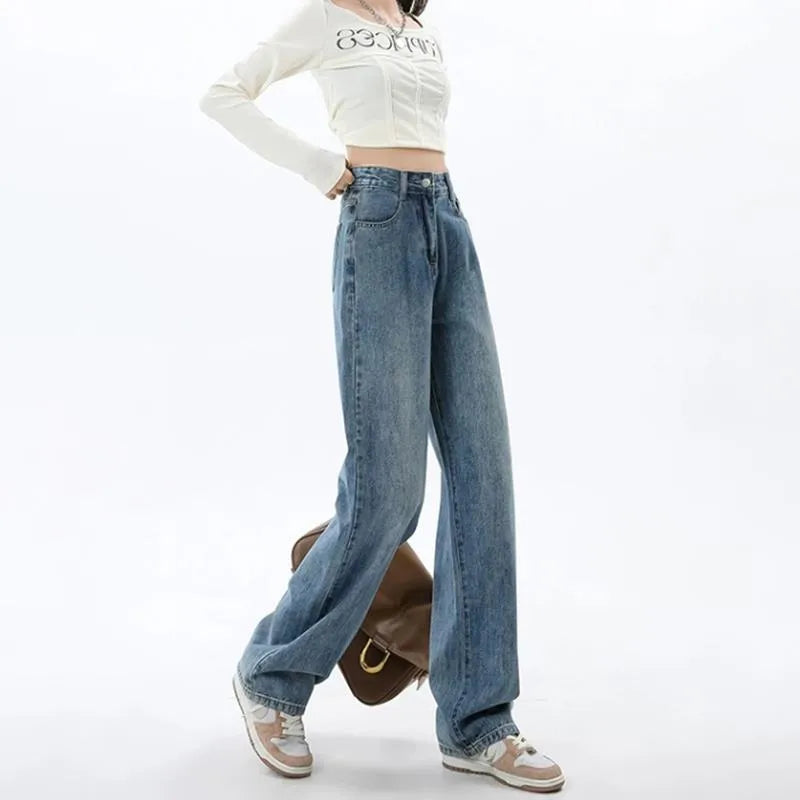Women's retro blue high waist wide leg jeans on a hanger, showing straight cut and front button detail.