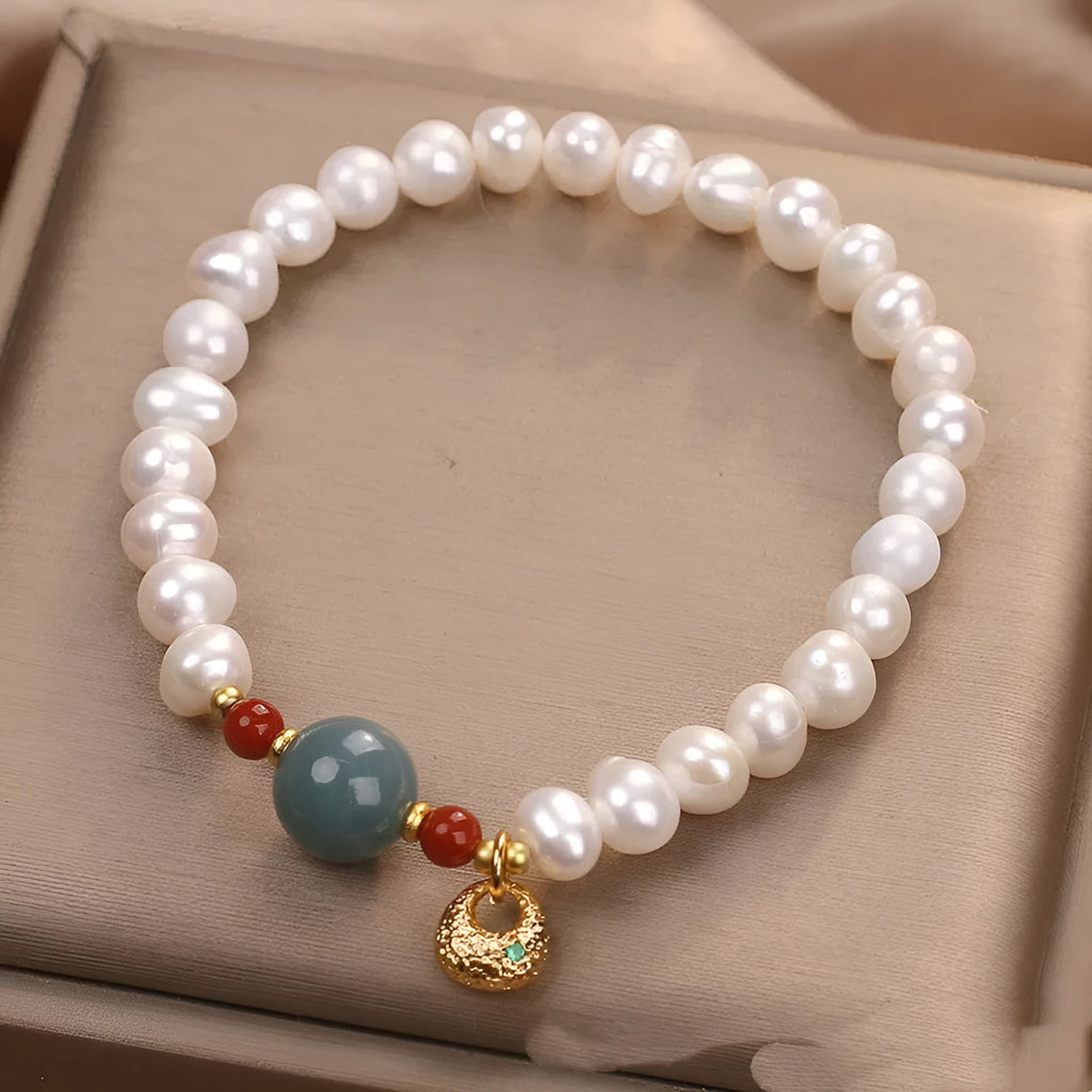 White freshwater pearl and aquamarine bracelet with opal centrepiece, ethnic style