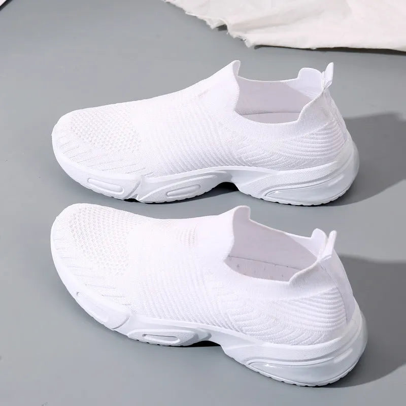 Slip-on breathable sock shoes in black, pink, khaki, and white colours on a white background.
