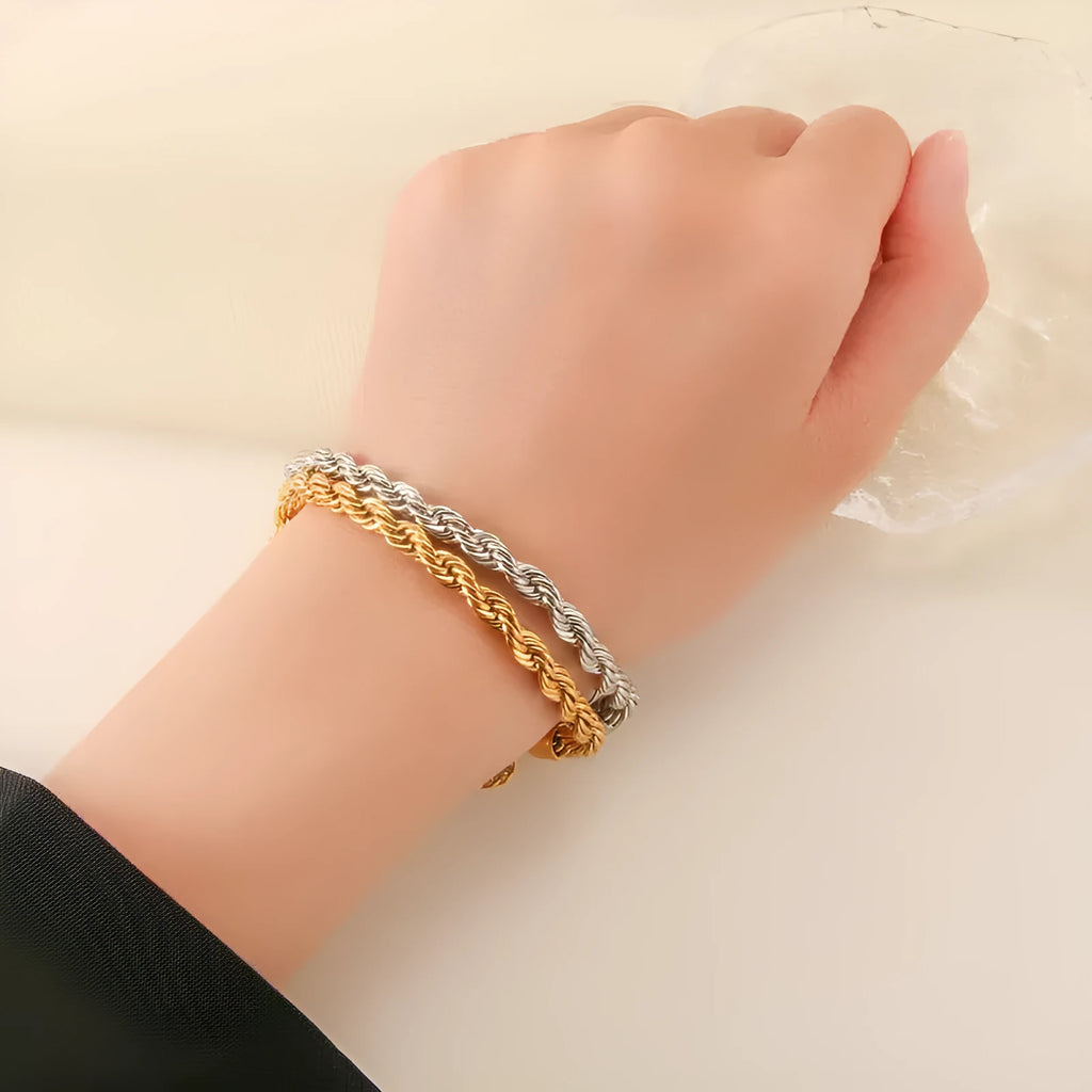 Alloy hip-hop twist bracelet for men in gold geometric chain style on a surface