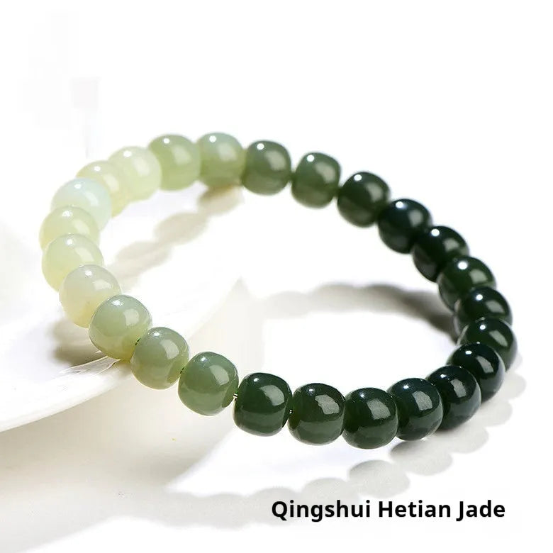 Natural clear water Hetian jade ball bracelet with gradient beads in round or barrel style.