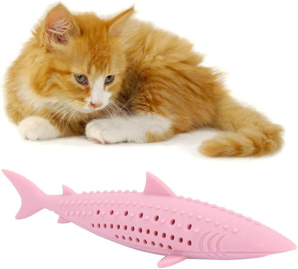 Green silicone fish-shaped cat chew toy with side holes on a white background