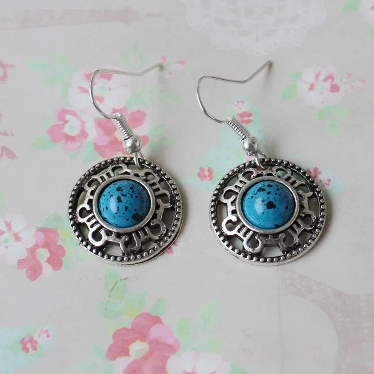 Handmade ethnic Miao silver geometric flower disk earrings with turquoise, in black, blue, or red.
