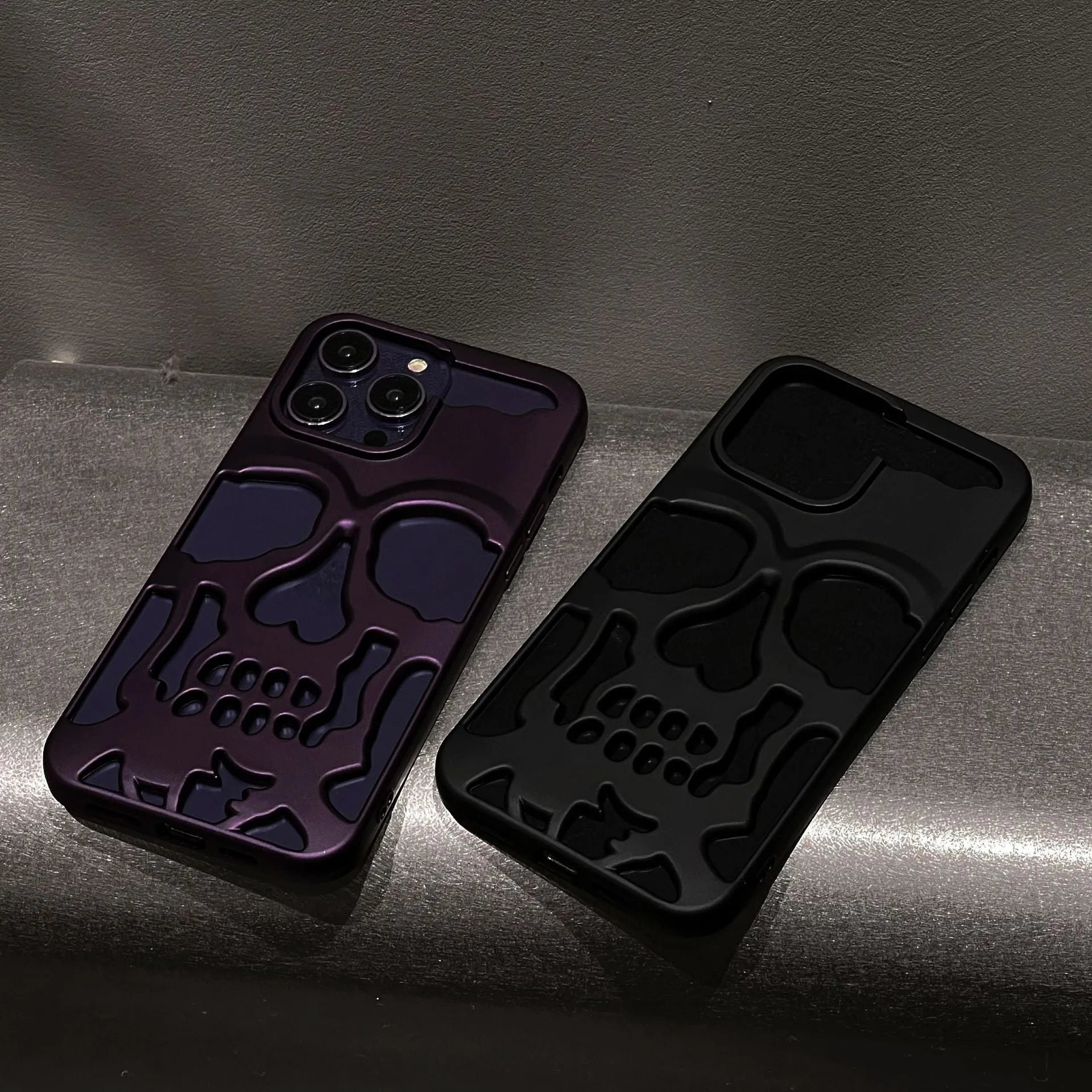Frosted skull TPU phone case in matte black for iPhone 14 Pro showing hollow skull design