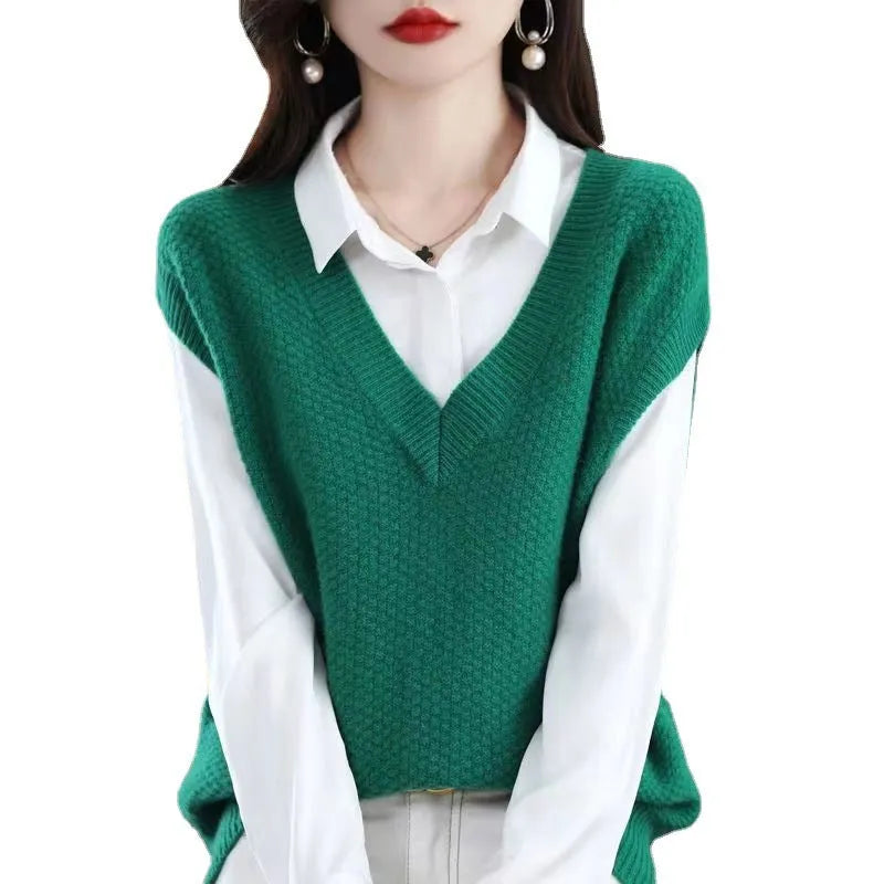 V-neck sleeveless knitted pullover vest with a raised 3D pattern in acrylic fibre, shown in camel colour.